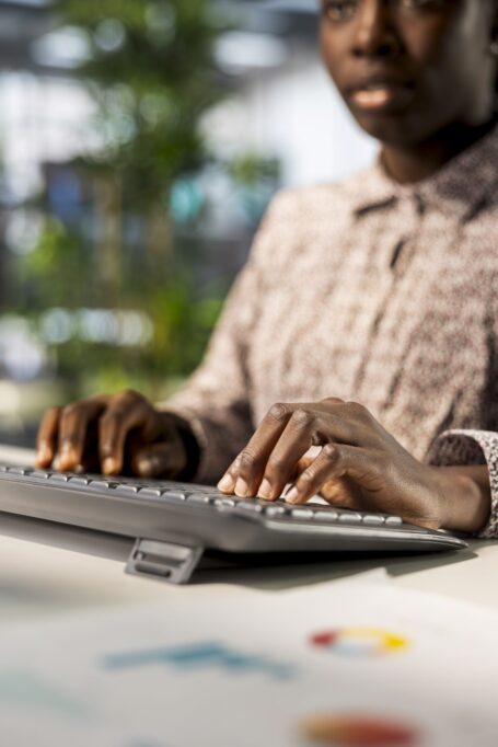 African american businesswoman managing administrative tasks at desk